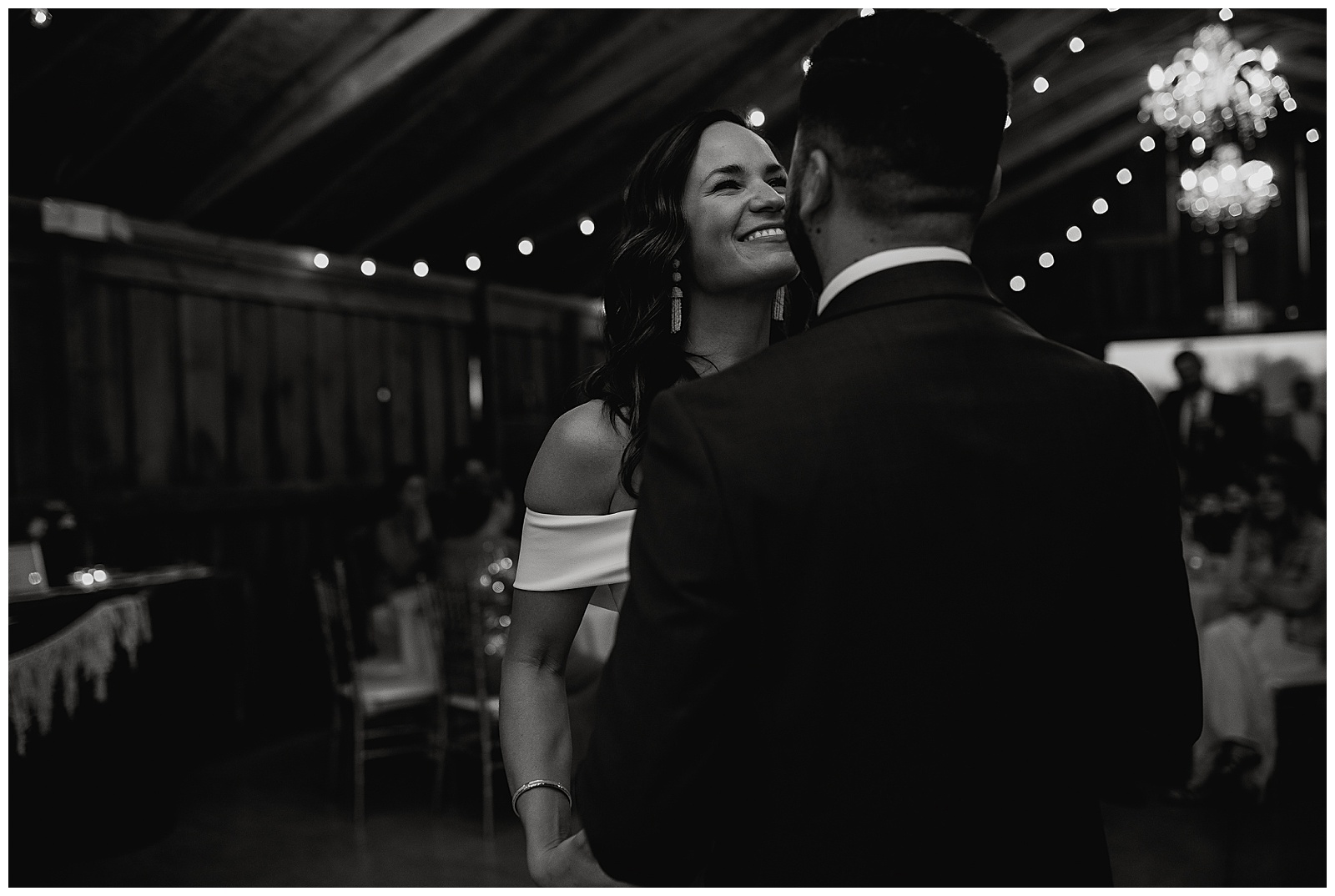 Bride and groom laughing during their first dance. 